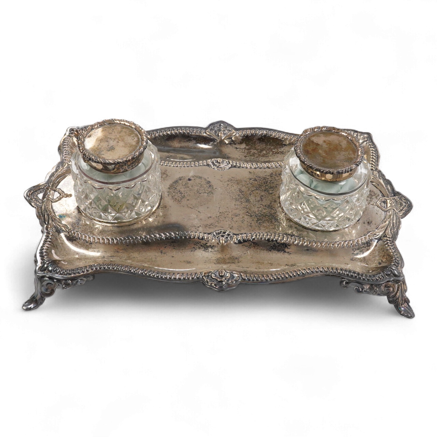 An Edwardian silver rectangular inkstand with two mounted glass wells, by Charles Stuart Harris, London, 1903, length 24.9cm, 12.2oz.